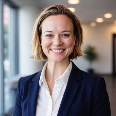 Picture of a woman smiling in a office setting